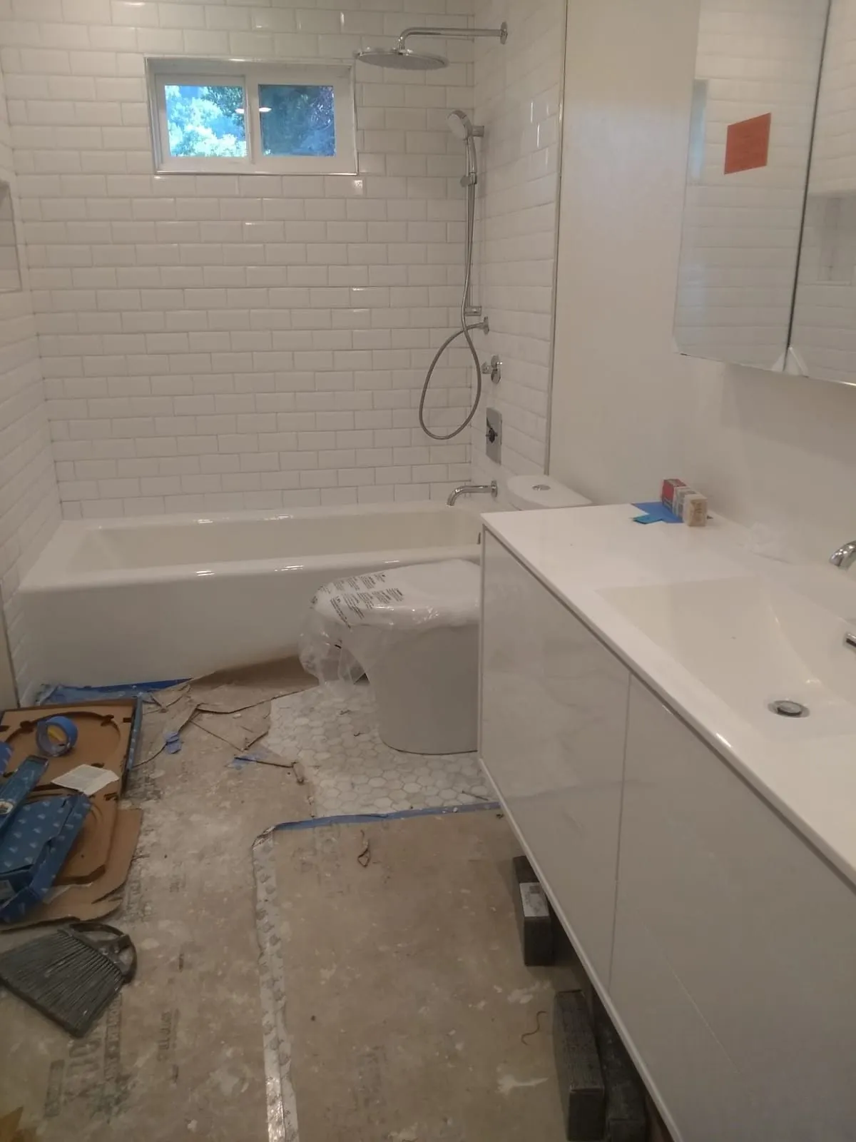 Bathroom during the build, alcove tub set in place before tiling and finishing