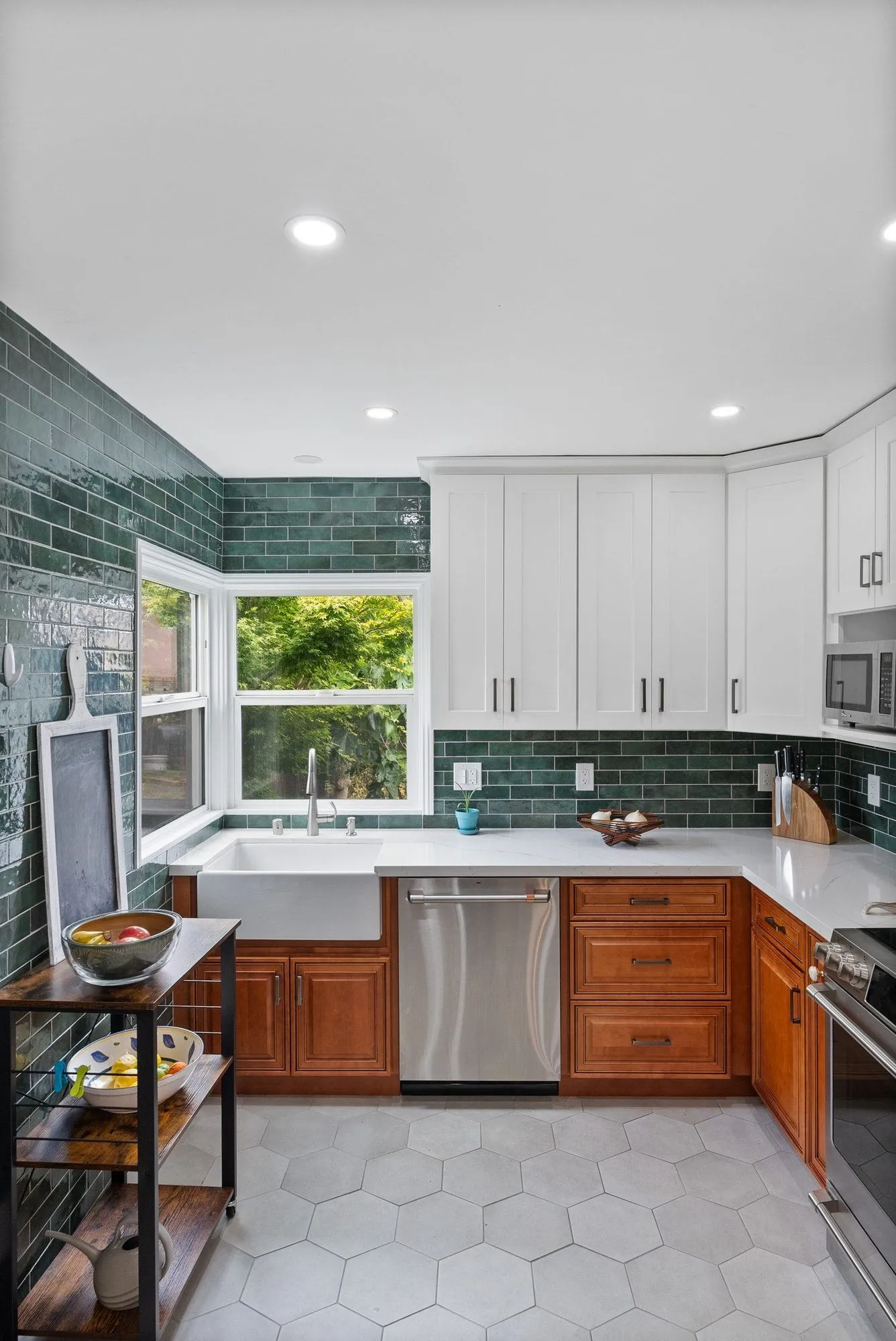 Corner counter run in white quartz with the hexagonal tile floor below