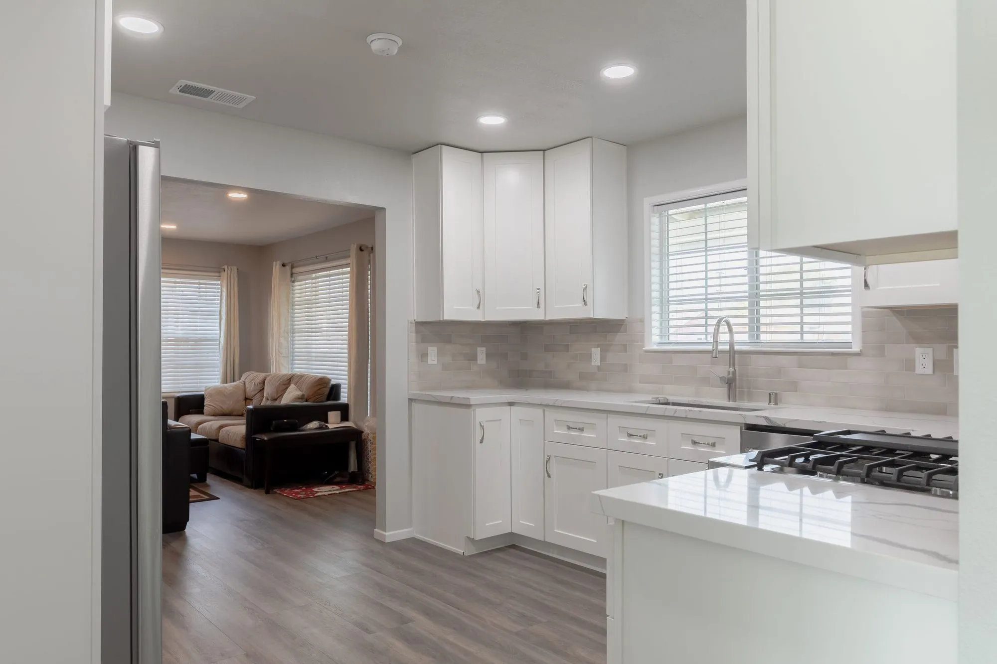 Tall cabinet run with a stainless refrigerator and built-in microwave