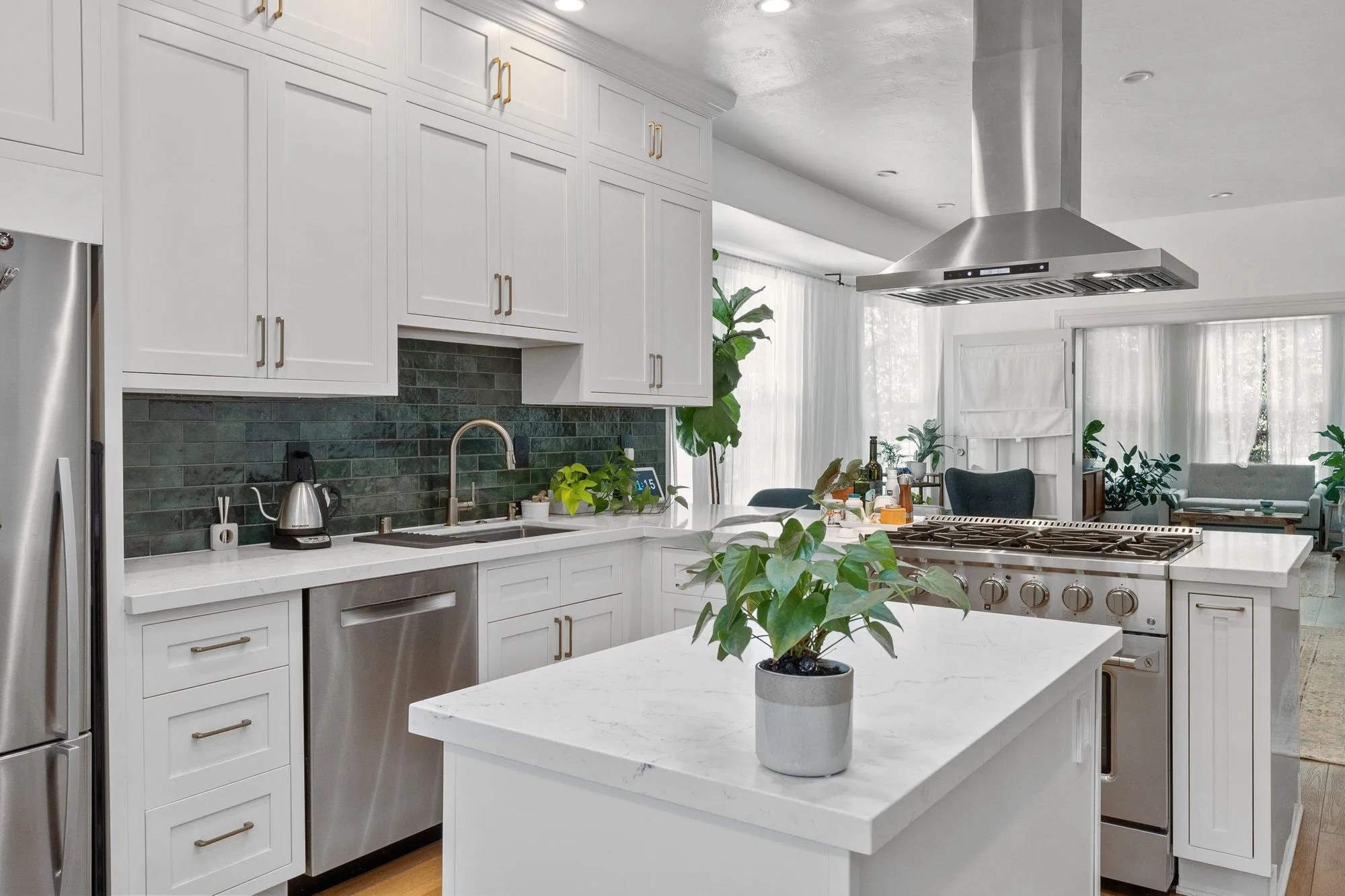 Quartz island alongside the counter run, with the dishwasher set beside the sink