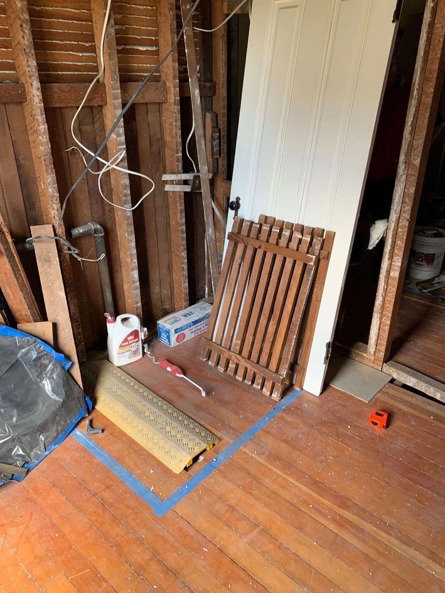 Original wood subfloor exposed during demolition