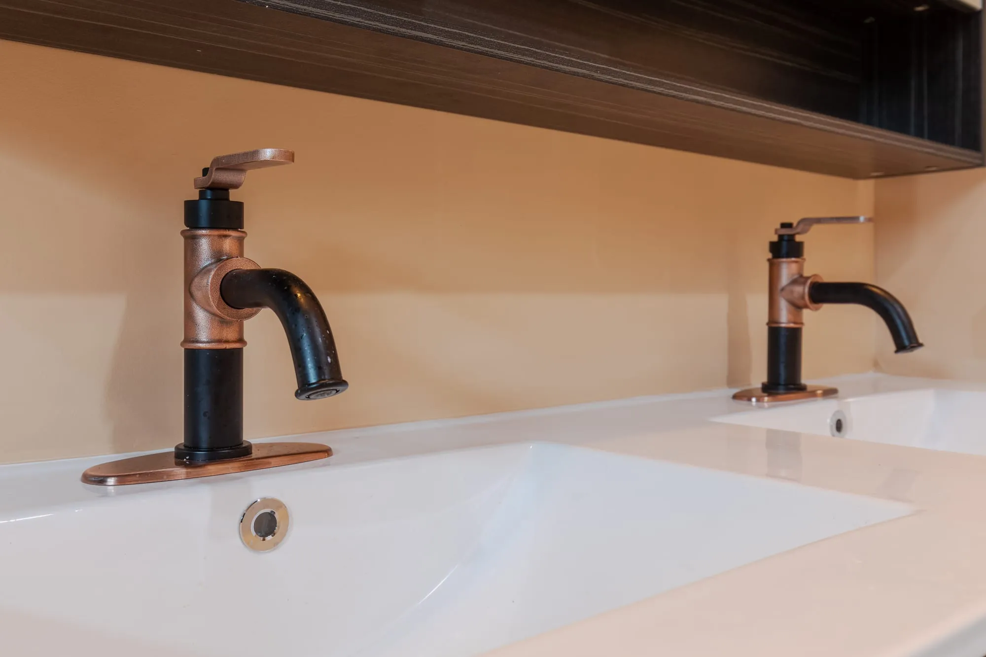 Bronze tap over the basin